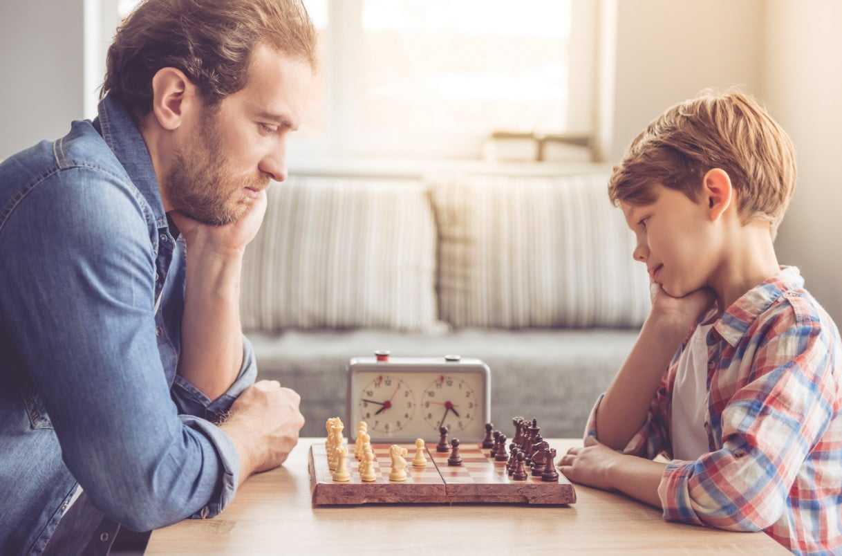 a man and a boy playing chess Christina Vaillancourt Registered Psychologist